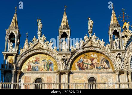 St Mark`s Basilica or San Marco close-up, Venice, Italy. It is top landmark in Venice. Beautiful Christian mosaic of luxury cathedral exterior, detail Stock Photo